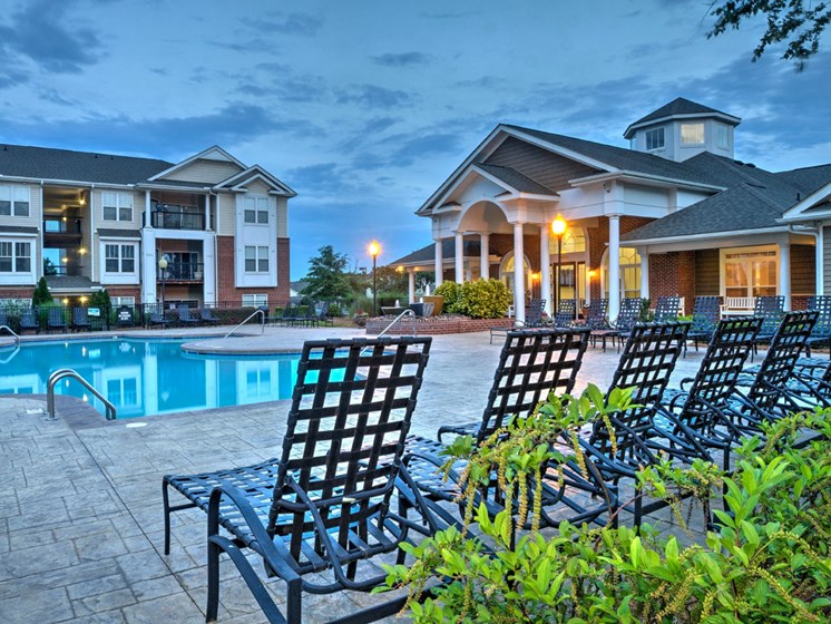 Refreshing pool with spacious sundeck and a city view at Abberly Woods Apartment Homes by HHHunt, North Carolina, 28216